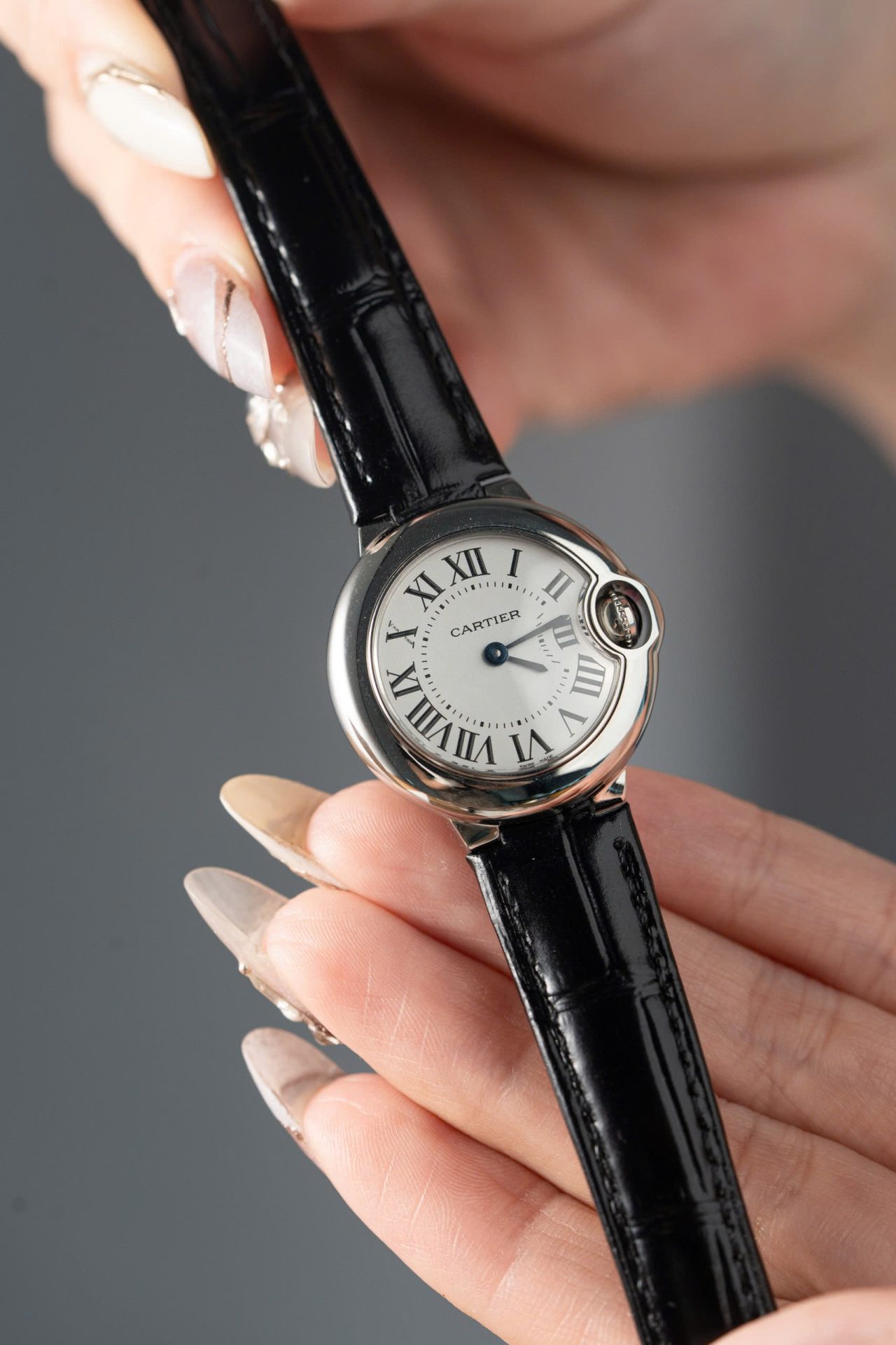 D2320D2A-B3AE-30CD-E2D6-9D497172D78F.jpg Cartier Ballon Bleu Women s Replica 11 Watch White Dial Black Leather Strap 28mm - Image 1