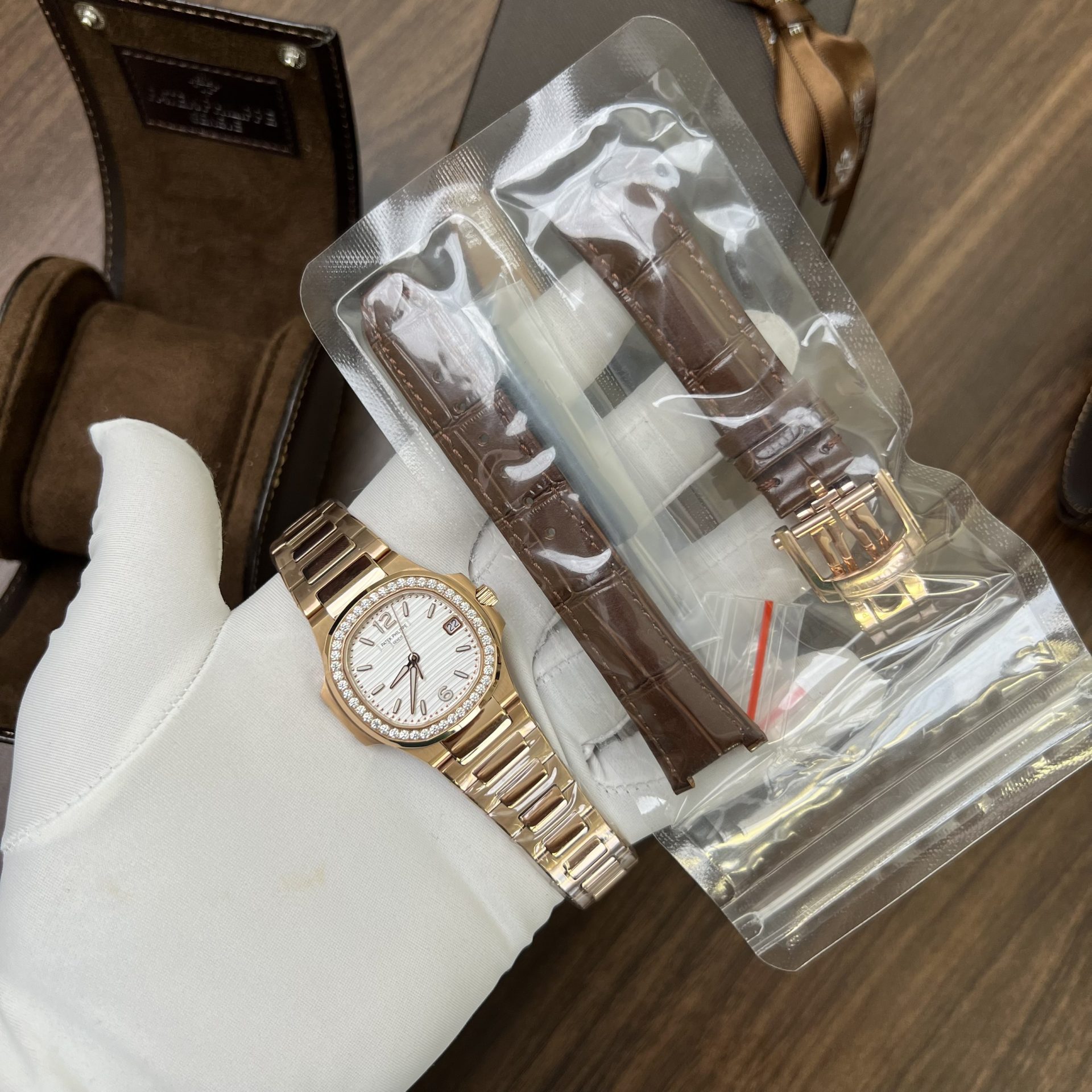 EB3EF9CD-19C4-AE79-AF30-2FF160760048.jpg Patek Philippe Replica 11 Watch Nautilus 7010 Rose Gold With Stone Metal Strap 32mm - Image 1